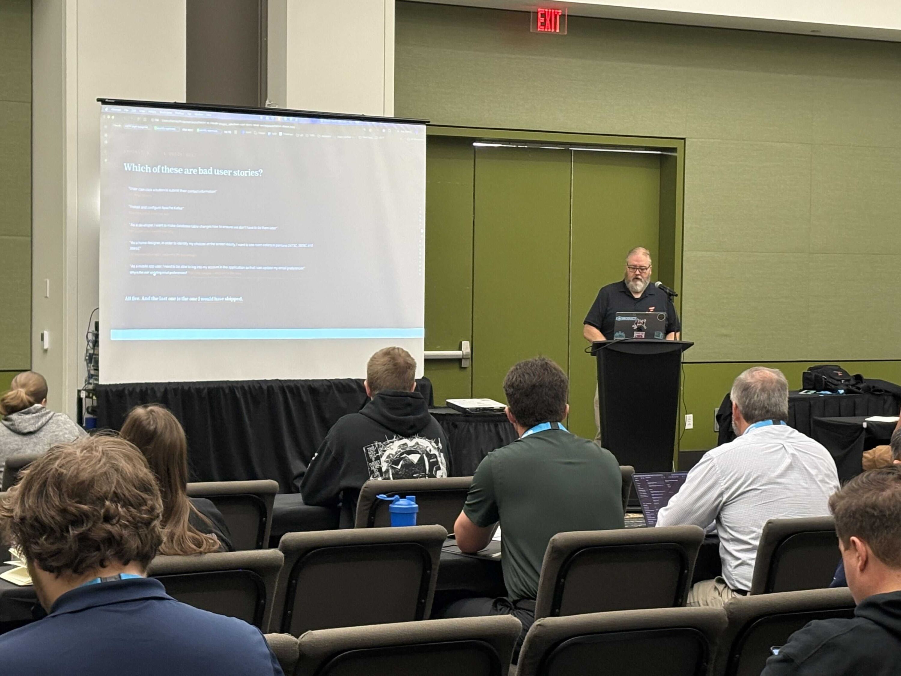 Jon Harcey presents a session on identifying bad user stories to a seated audience at TechFuse Des Moines.